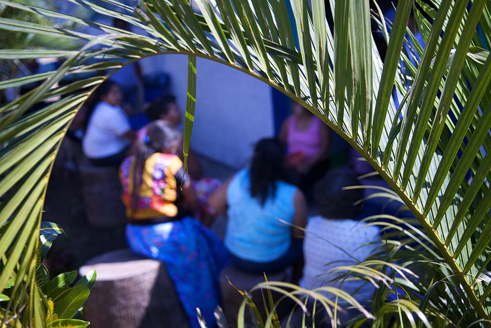 Women, many who have traveled over an hour by bus to get there, wait to be seen at the clinic.