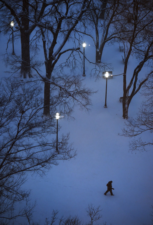 A person makes their way through Franklin Square Park as it snows on Friday January 22, 2016 in Washington, DC. A large snow event was being predicted for Washington, DC area. (Photo by Matt McClain/ The Washington Post)