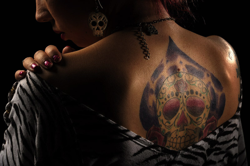 Kaitlyn Cooper, 25, of Baltimore, MD poses for a portrait while taking part in the 2011 DC Tattoo Arts Expo at the Doubletree Hotel Washington DC- Crystal City in Arlington, VA on January 14, 2011. The tattoo was inspired from the sugar skulls that are associated with the Day of the Dead. The event concludes Sunday and includes over 100 tattoo artists. (Photo by Matt McClain/The Washington Post)