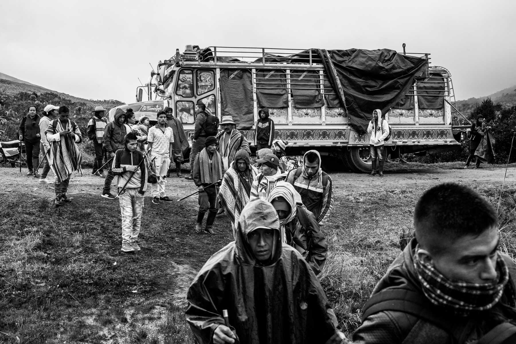 Indigenous Legacy Members of the Nasa indigenous community of Tacueyó get out of the 'chiva' (bus) in the Páramo of Pisnos to start the celebration of the 'Khabu fxizehnxi' ('Refreshing of the Batons”), one of the five main rituals of the Nasa indigenous people of the Cauca region in Colombia. Cauca region, Colombia, January 2019.