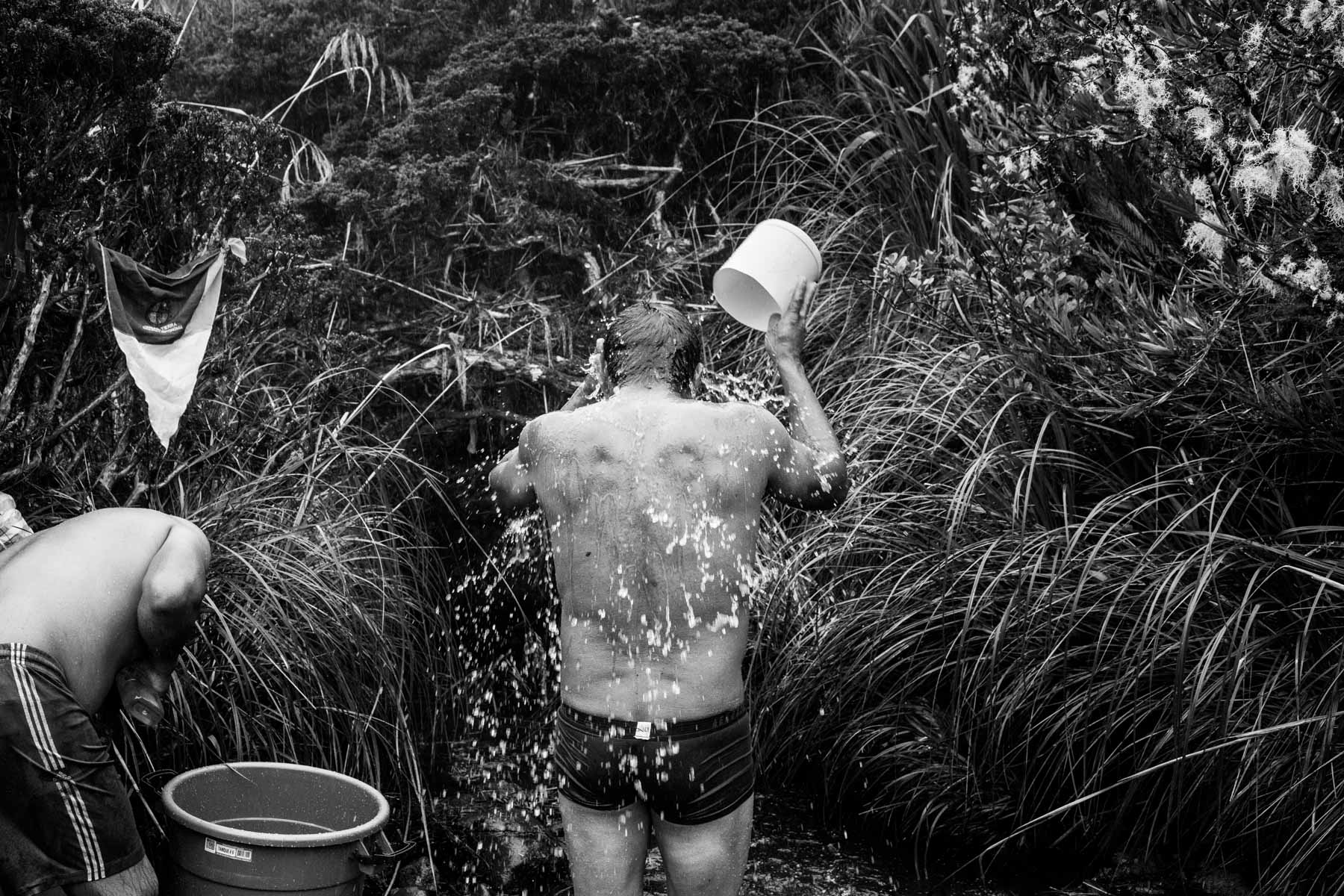 Indigenous Legacy Member of the Nasa indigenous community washes himself in the icy waters of the Páramo de Pisnos as part of the cleansing ritual of the 'Khabu fxizehnxi' ('Refreshing of the Batons”), one of the five main rituals of the Nasa indigenous people of the Cauca region in Colombia. Cauca region, Colombia, January 2019.