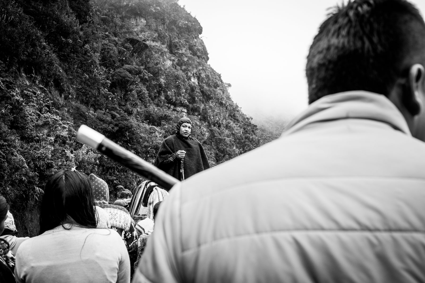 Indigenous Legacy Political leader from the Nasa indigenous reservation of Tacueyó speaks to the community in the Páramo de Pisnos after the celebration of the cleansing ritual of the 'Khabu fxizehnxi' ('Refreshing of the Batons”), one of the five main rituals of the Nasa indigenous people of the Cauca region in Colombia. The leader warns the community about the threats and murders that are increasing exponentially within the territory. Cauca region, Colombia, January 2019.
