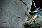 David Quinney leaps for a hold on a V7 bouldering problem at Little Rock City, a climbing area on a golf course near Chattanooga, Tenn.