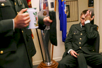 Chris Box, left, rubs his eyes while listening to Kenneth Nitzche, a fellow Army ROTC member, after a 5:30 a.m. shift for a 24-hour Veteran's Day vigil in Carbondale, Ill. 