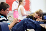 Matthew Tedeschi plays his trumpet as Haevin Britt, both La Salle Lincoln Junior High School students, looks on at Parkside Middle School during the 51st annual Band-O-Rama festival in Peru, Ill.