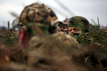 Southern Illinois University Athletic Director Mario Moccia, left, watches for fowl out of a blind during the Saluki Waterfowl Hunt at Grassy Lake Hunting Club in Ware, Ill.